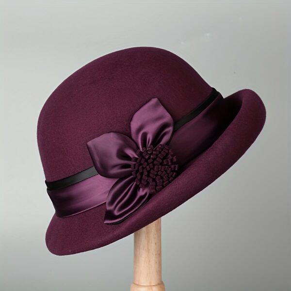 Newness Winter Wool Bucket Hat: A stylish 100% wool bucket hat with a rolled brim and a delicate floral accent.