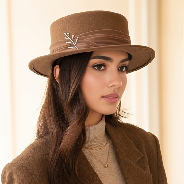 The Newness Parisian Wool Felt Hat in classic black, showcasing its elegant shape and soft wool texture.