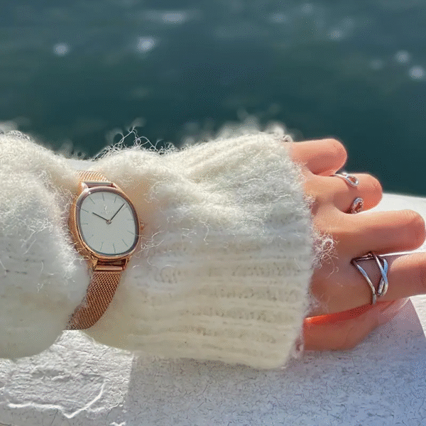 Sleek minimalist women's stainless steel watch by Newness. Features a simple, elegant design perfect for everyday wear.