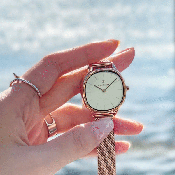 Sleek minimalist women's stainless steel watch by Newness. Features a simple, elegant design perfect for everyday wear.