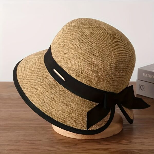Stylish woman wearing a Newness Riviera Escape Women's Summer Fedora, a breathable and chic sun hat, perfect for a summer getaway.