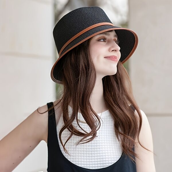 Stylish Newness Riviera Escape Straw Bucket Hat, perfect for summer adventures. Lightweight and versatile, in a natural straw color.