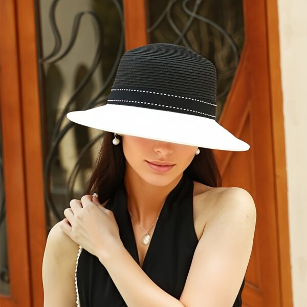 Stylish wide-brimmed straw sun hat, perfect for escaping to the Riviera or any sunny destination. Breathable and chic.