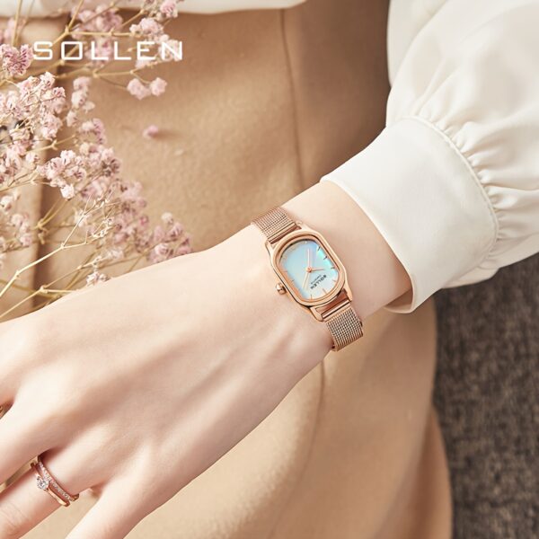 Close-up of Sangdo Women's Elegant Square Watch with blue-green dial, rose gold-toned stainless steel band, showcasing its minimalist design and delicate details.