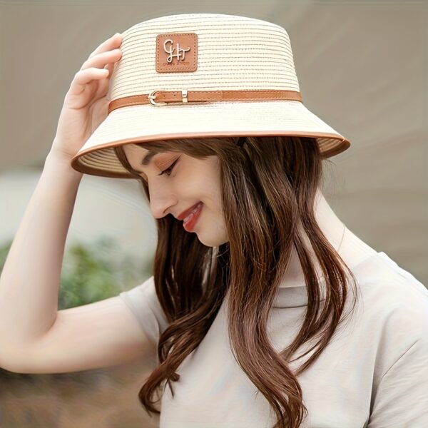 Stylish Newness Riviera Escape Straw Bucket Hat, perfect for summer adventures. Lightweight and versatile, in a natural straw color.