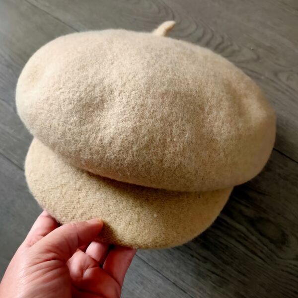 Stylish womens lightweight beret hat in six versatile colors Features a wide brim adjustable fit and soft solid color design Perfect for autumn and winter
