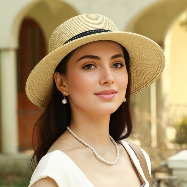 Stylish wide-brimmed straw sun hat, perfect for escaping to the Riviera or any sunny destination. Breathable and chic.