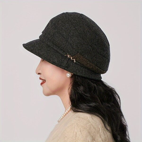 Stylish woman wearing a chic Newness Parisian Acrylic Beret Hat, perfect for winter. The hat is warm, comfortable, and effortlessly stylish.