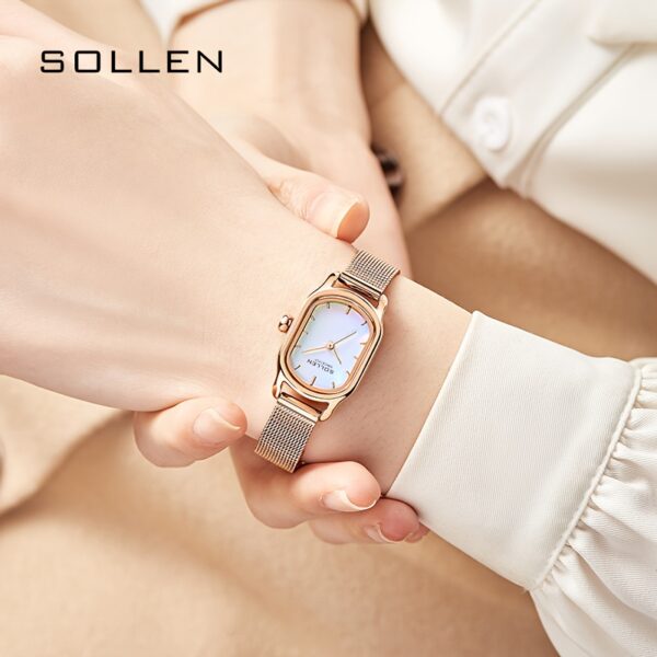 Close-up of Sangdo Women's Elegant Square Watch with blue-green dial, rose gold-toned stainless steel band, showcasing its minimalist design and delicate details.
