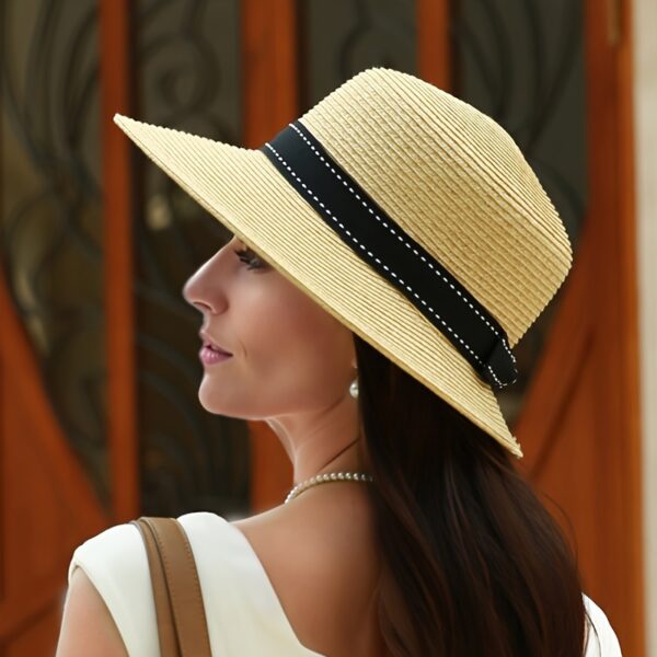 Stylish wide-brimmed straw sun hat, perfect for escaping to the Riviera or any sunny destination. Breathable and chic.