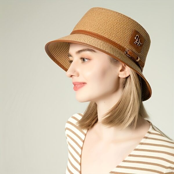 Stylish Newness Riviera Escape Straw Bucket Hat, perfect for summer adventures. Lightweight and versatile, in a natural straw color.