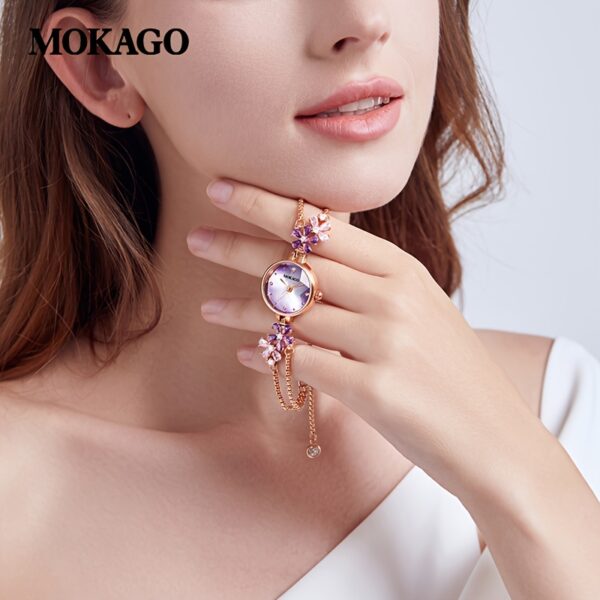 Newness Violet Bloom Crystal Bracelet Watch: A stunning violet watch with sparkling crystals on a delicate bracelet.