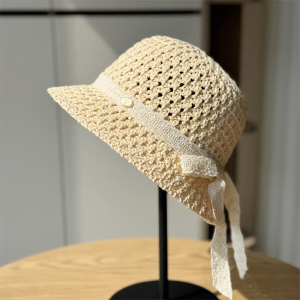 Stylish Newness Summer Breeze Crochet Bucket Hat in white, worn by a model. Perfect for sunny days.