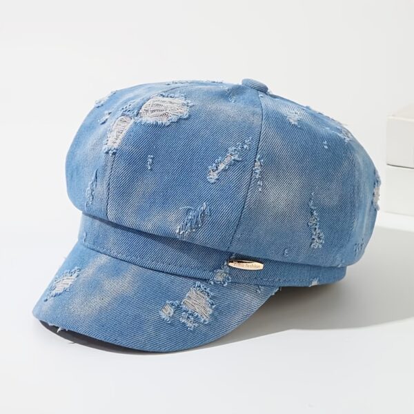 Newness Parisian Nights Distressed Suede Beret: A stylish, dark-toned suede beret with a distressed finish, adding Parisian chic to any outfit.
