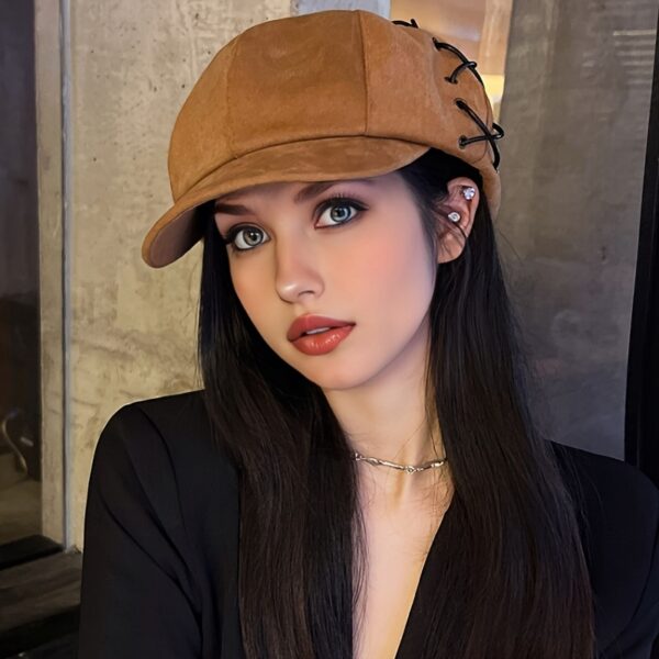 Stylish Newness Parisian Octagonal Beret Cap in deep navy blue, worn at a rakish angle by a model. Lightweight and perfect for fall or winter.