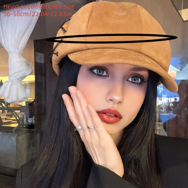 Stylish Newness Parisian Octagonal Beret Cap in deep navy blue, worn at a rakish angle by a model. Lightweight and perfect for fall or winter.