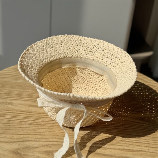 Stylish Newness Summer Breeze Crochet Bucket Hat in white, worn by a model. Perfect for sunny days.