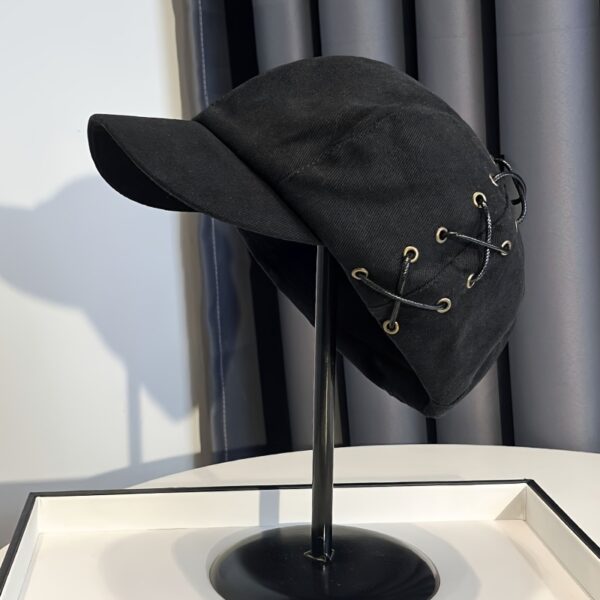 Stylish Newness Parisian Octagonal Beret Cap in deep navy blue, worn at a rakish angle by a model. Lightweight and perfect for fall or winter.