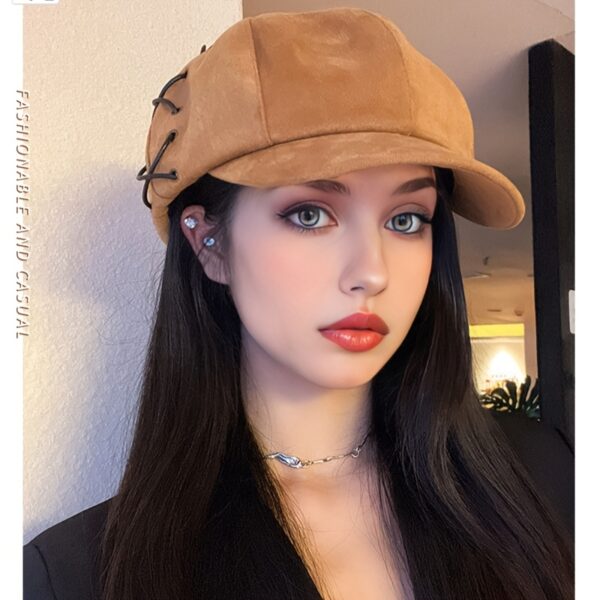 Stylish Newness Parisian Octagonal Beret Cap in deep navy blue, worn at a rakish angle by a model. Lightweight and perfect for fall or winter.