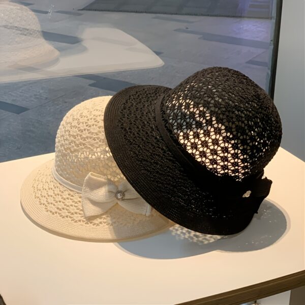 The Newness Riviera Straw Bucket Hat: A stylish and protective straw hat, perfect for summer. Breathable and lightweight, ideal for sunny adventures.