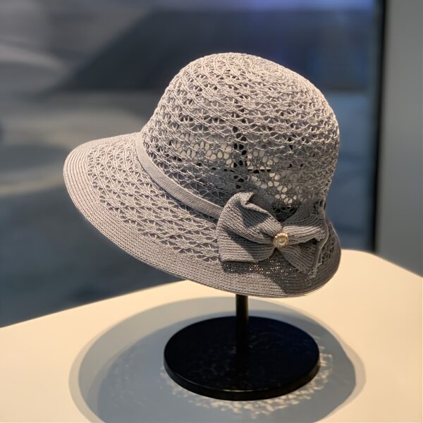 The Newness Riviera Straw Bucket Hat: A stylish and protective straw hat, perfect for summer. Breathable and lightweight, ideal for sunny adventures.