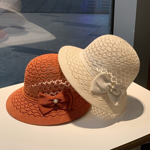 The Newness Riviera Straw Bucket Hat: A stylish and protective straw hat, perfect for summer. Breathable and lightweight, ideal for sunny adventures.