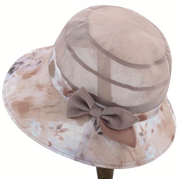 Stylish woman wearing Newness Riviera Women's Sun Hat, enjoying a sunny day at the beach.