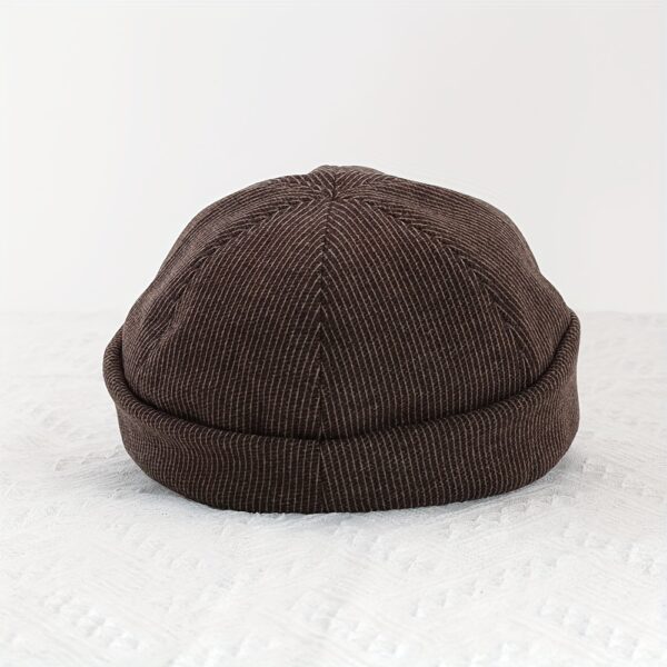 Stylish Newness Boulevard Newsboy Cap in winter setting. A close-up shows the texture and details of the warm, chic cap.
