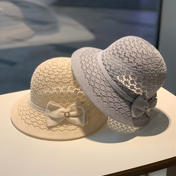 The Newness Riviera Straw Bucket Hat: A stylish and protective straw hat, perfect for summer. Breathable and lightweight, ideal for sunny adventures.