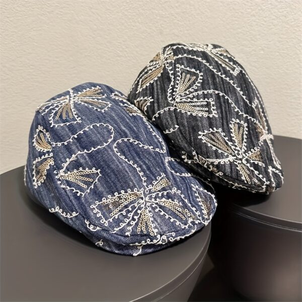 Newness Midnight Bloom Embroidered Beret in blue and black floral denim with golden accents. Lightweight, stylish, and perfect for streetwear.