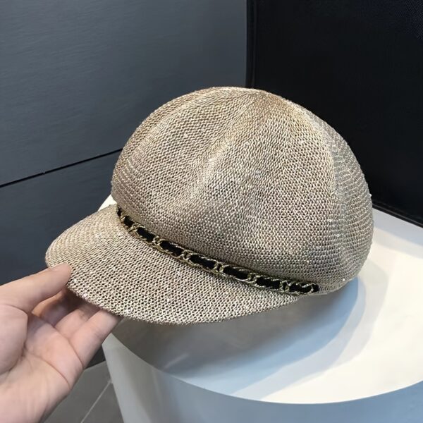 Stylish woman wearing the Newness Riviera Women's Newsboy Cap, showcasing its breathable and comfortable fit. Perfect for everyday wear or a special occasion.