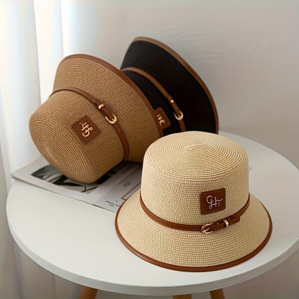 Stylish Newness Riviera Escape Straw Bucket Hat, perfect for summer adventures. Lightweight and versatile, in a natural straw color.