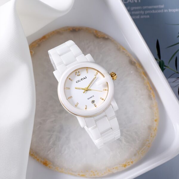 Close-up of the OUPAI Celestial White Ceramic Quartz Watch, showcasing its elegant design and white ceramic band.