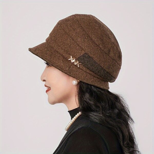 Stylish woman wearing a chic Newness Parisian Acrylic Beret Hat, perfect for winter. The hat is warm, comfortable, and effortlessly stylish.