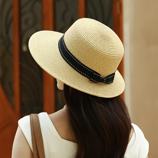 Stylish wide-brimmed straw sun hat, perfect for escaping to the Riviera or any sunny destination. Breathable and chic.