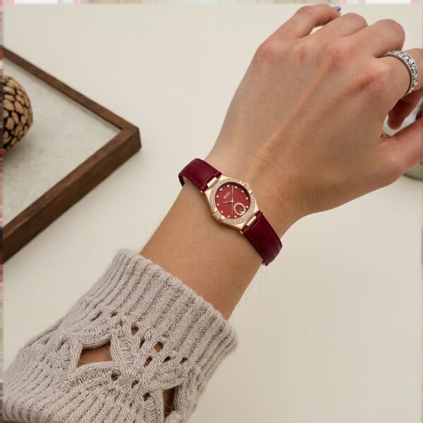 Crimson Elegance Red Leather Watch by Newness, showcasing its red leather strap and elegant design.