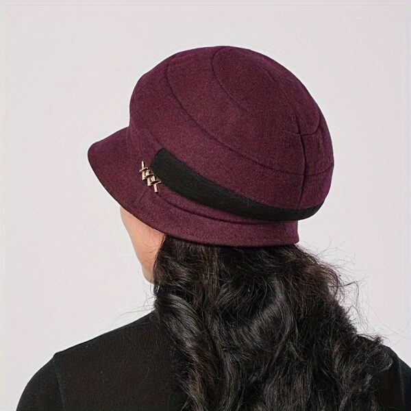 Stylish woman wearing a chic Newness Parisian Acrylic Beret Hat, perfect for winter. The hat is warm, comfortable, and effortlessly stylish.