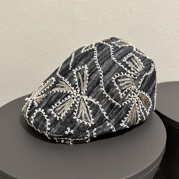 Newness Midnight Bloom Embroidered Beret in blue and black floral denim with golden accents. Lightweight, stylish, and perfect for streetwear.