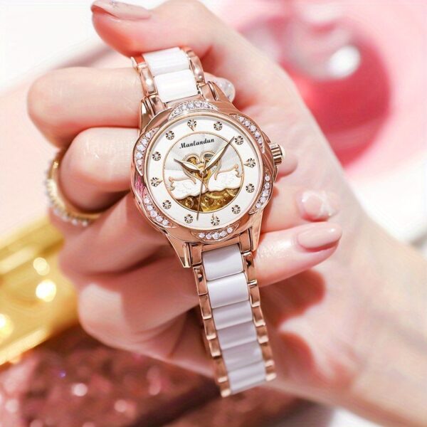 Newness Celestial Swan Rose Gold Quartz Watch with luminous hands and stainless steel band.