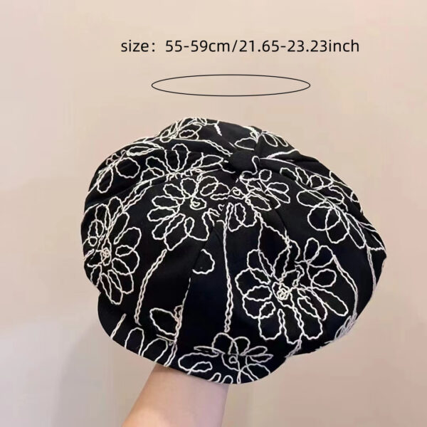 Midnight Bloom Embroidered Beret Cap by Newness. A stylish black beret with delicate embroidery, perfect for adding a touch of Parisian chic to any outfit.