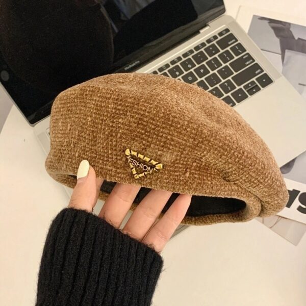 The Parisian Winter Beret Hat by Newness in a rich burgundy color, styled effortlessly with a classic autumn outfit.