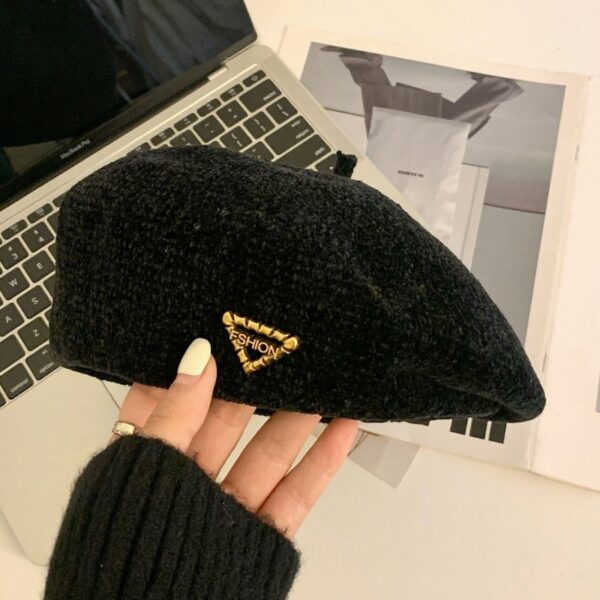 The Parisian Winter Beret Hat by Newness in a rich burgundy color, styled effortlessly with a classic autumn outfit.