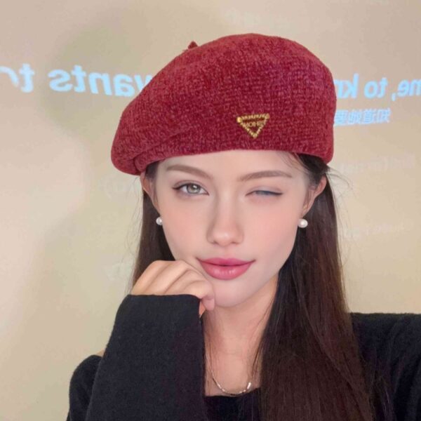 The Parisian Winter Beret Hat by Newness in a rich burgundy color, styled effortlessly with a classic autumn outfit.