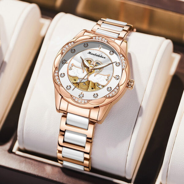 Newness Celestial Swan Rose Gold Quartz Watch with luminous hands and stainless steel band.