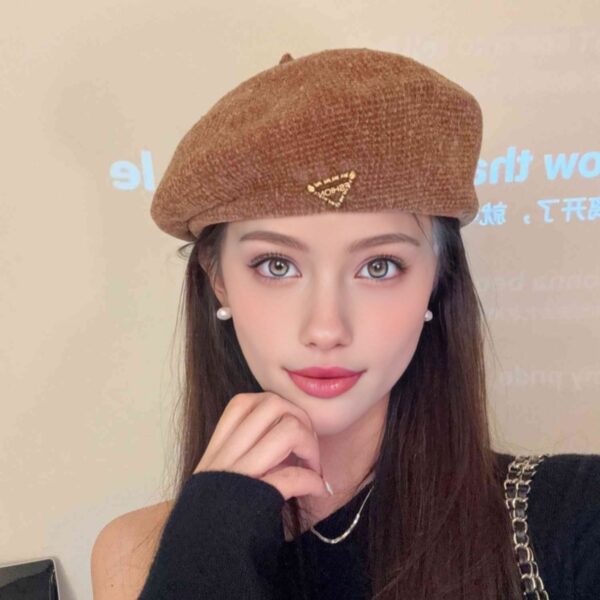 The Parisian Winter Beret Hat by Newness in a rich burgundy color, styled effortlessly with a classic autumn outfit.