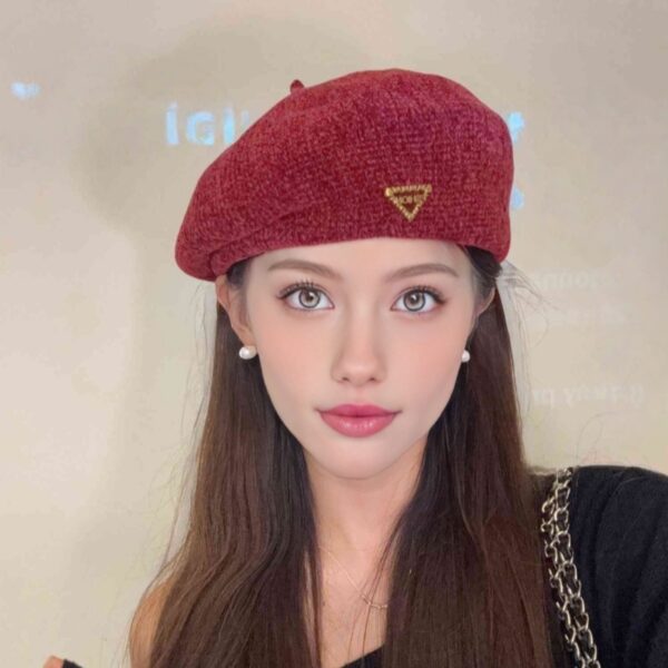 The Parisian Winter Beret Hat by Newness in a rich burgundy color, styled effortlessly with a classic autumn outfit.