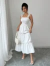 Effortlessly chic Newness Summer Solstice Lace Trim Midi Dress perfect for summer soirées and vacations Model wears a midi length dress with delicate lace trim