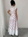 Model wearing a chic butterfly print dress perfect for summer The dress is made of lightweight polyester and floats beautifully