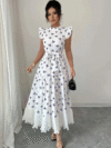 Model wearing a chic butterfly print dress perfect for summer The dress is made of lightweight polyester and floats beautifully