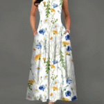 Model wearing the Newness Summer Breeze floral print dress a versatile and comfortable dress with pockets perfect for any season